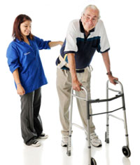 therapist helping patient with walker