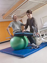 patient exercising on ball